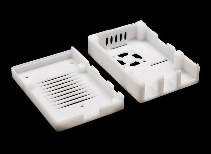 White SLA resin prototype housing with smooth surface finish and internal assembly features