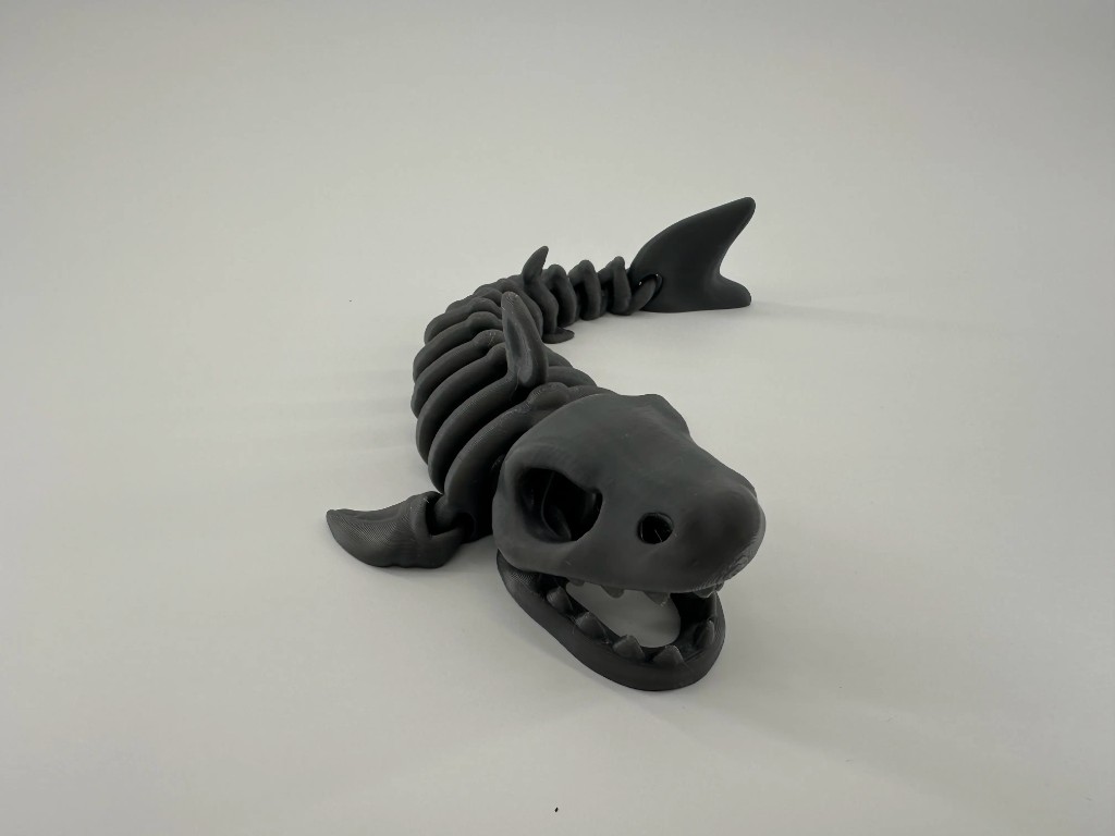 Matte black articulated shark skeleton print
