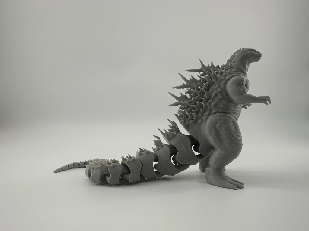 Grey Godzilla figure with articulated tail