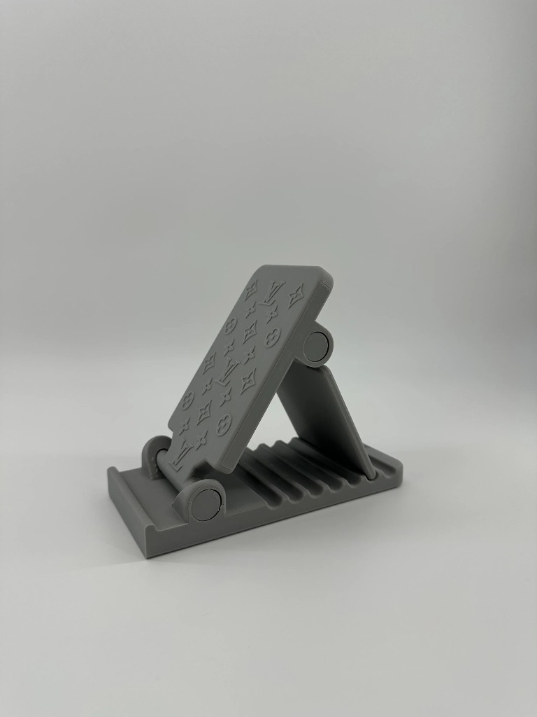 Folding grey phone stand with monogram pattern
