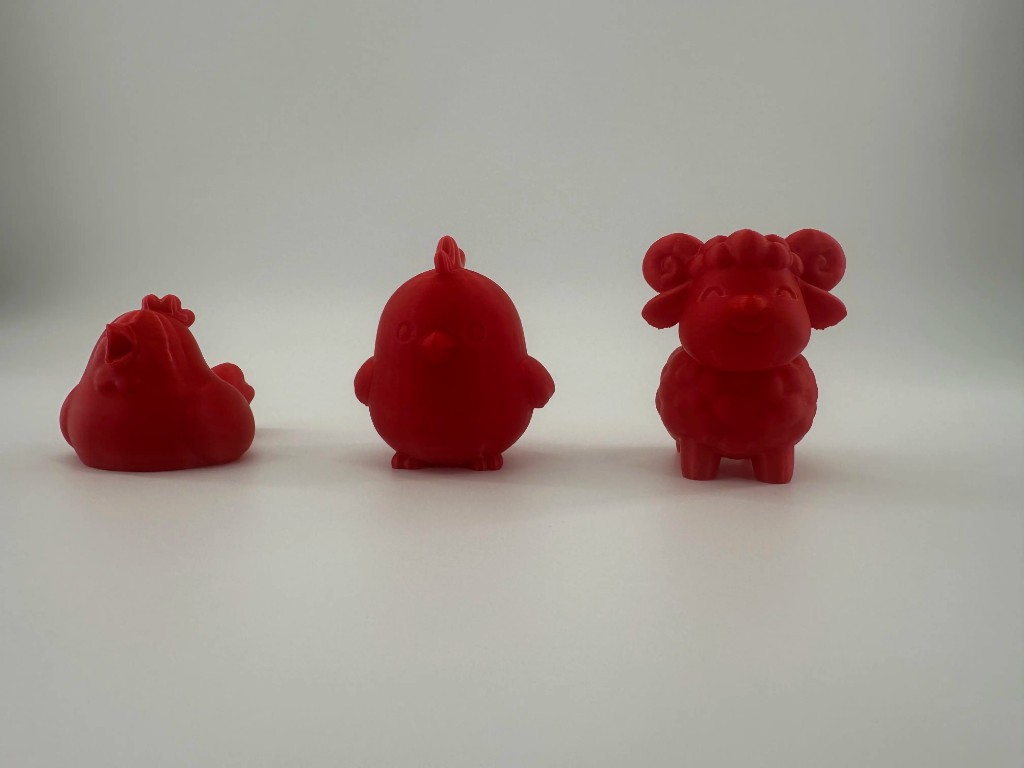 Red rooster chick and sheep figurines