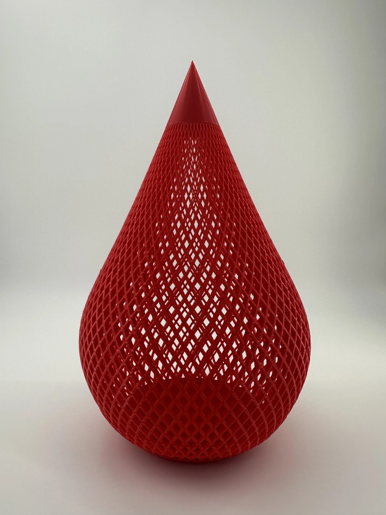 Red diamond-lattice teardrop sculpture