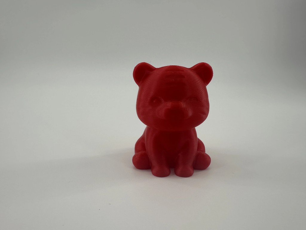 Bright red sitting tiger figurine