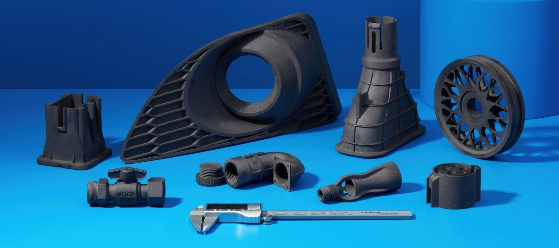 Assortment of production-grade 3D printed nylon functional material samples.png